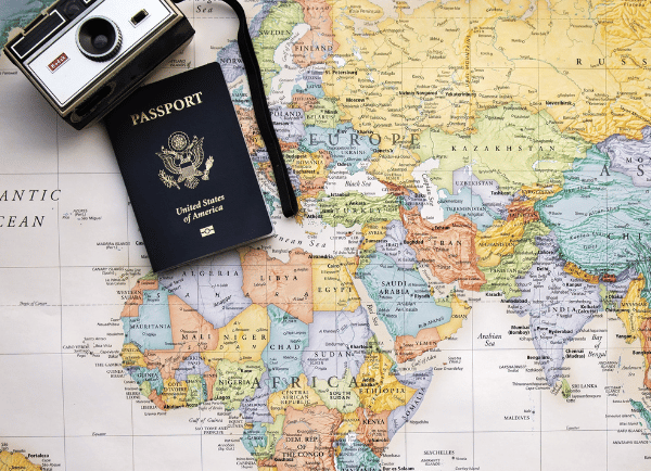 a map and camera on it with passport