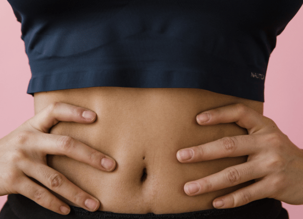 a women holding- belly