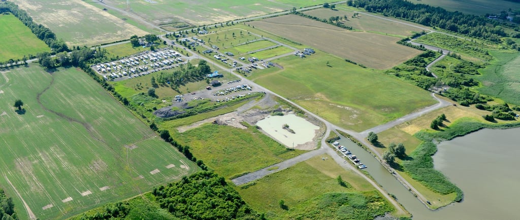 maitland shoresl RV park and marina near green farmland and wind turbines.