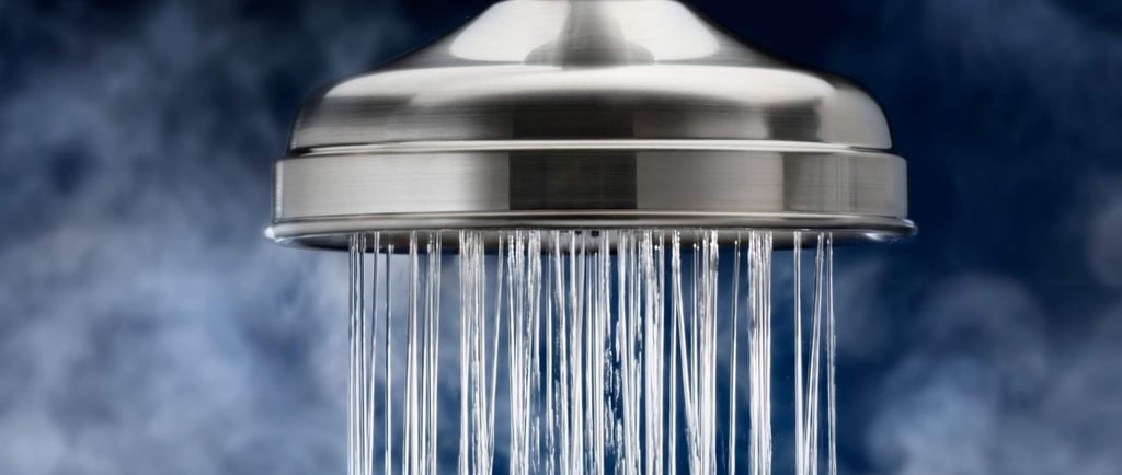 a shower head with water flowing from it
