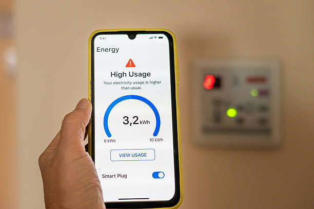 Electrician using TradeCert EICR app for inspection