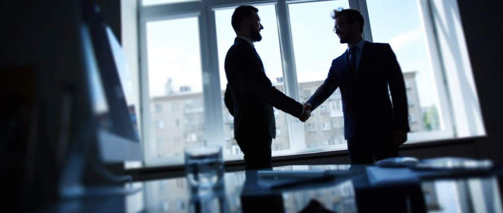 Two people shaking hands, agreeing to a fulldome distribution deal.