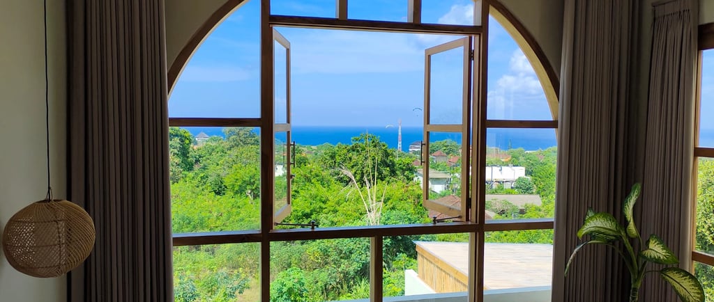 Luxury Bali villa with open window and panoramic ocean view – legal ownership guide for foreigners