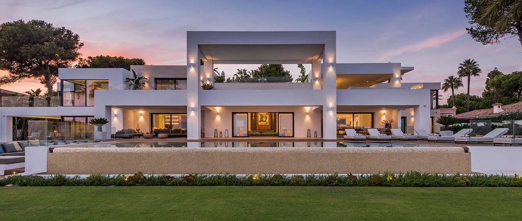 Contemporary beachfront villa façade at sunset