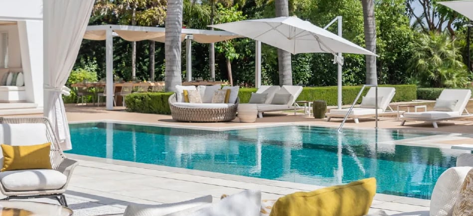 Luxury pool terrace with shaded lounges at Villa Serenity