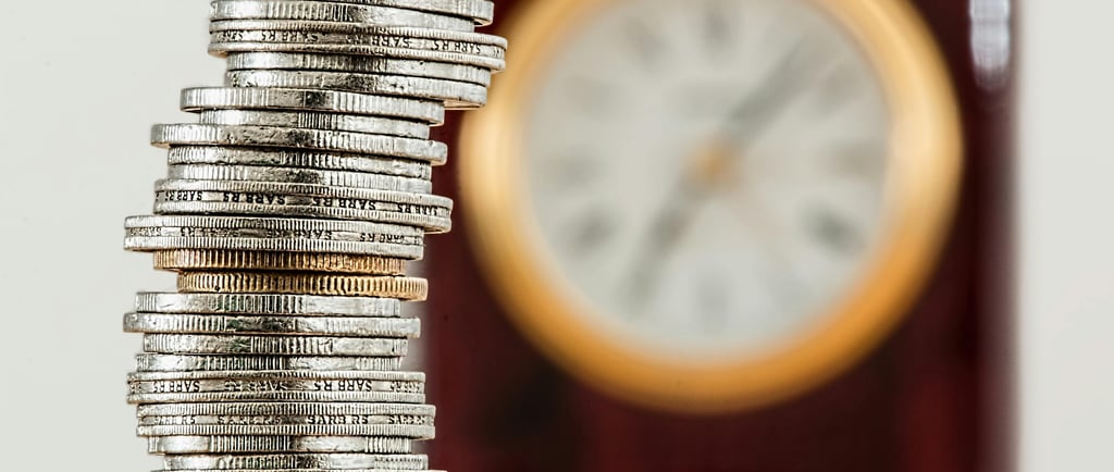 a stack of coins sitting on top of a pile of coins