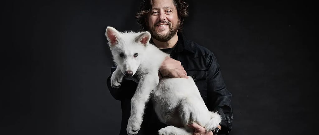 Colossal CEO Ben Lamm with a dire wolf pup.