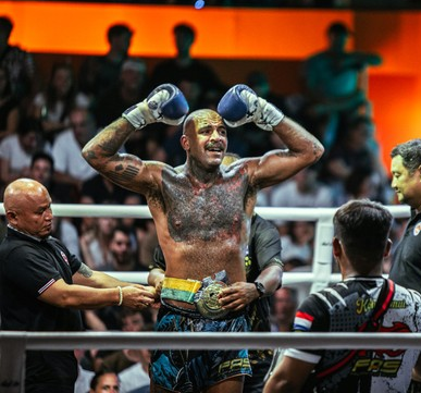 Potrait and belt on his winning Muay thai fight