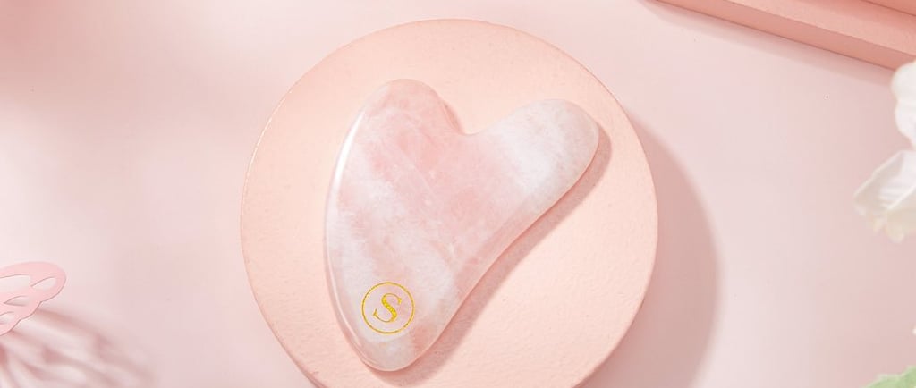 a pink heart shaped guasha on a pink plate