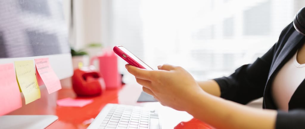 woman working email marketing office cellphone computer