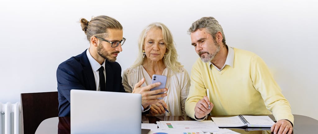 young man elderly mature business presentation laptop phone office work working