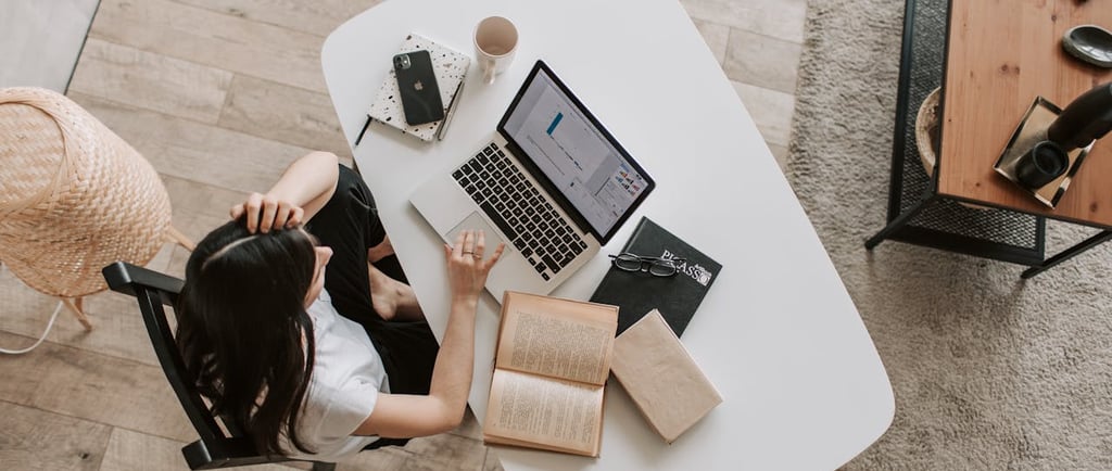 woman working from home remote laptop cellphone seo
