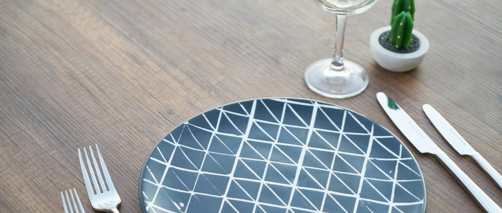 a plate with a cactus plant in the middle of it