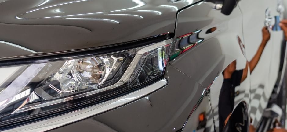 a man is detailing a car