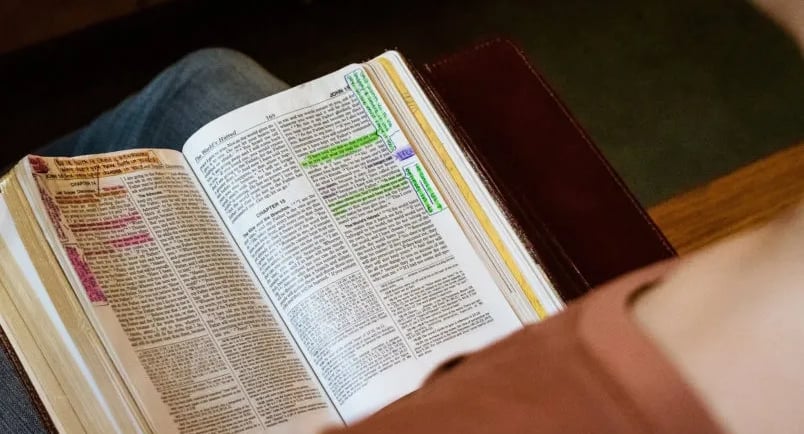 An Open Bible worn by personal study of God's Word