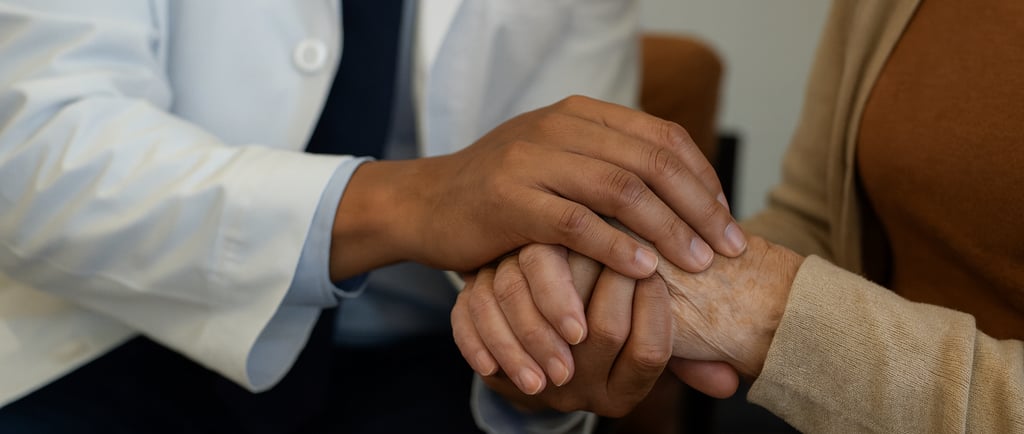 Neurology provider offering supportive care, holding a patient’s hand during consultation.