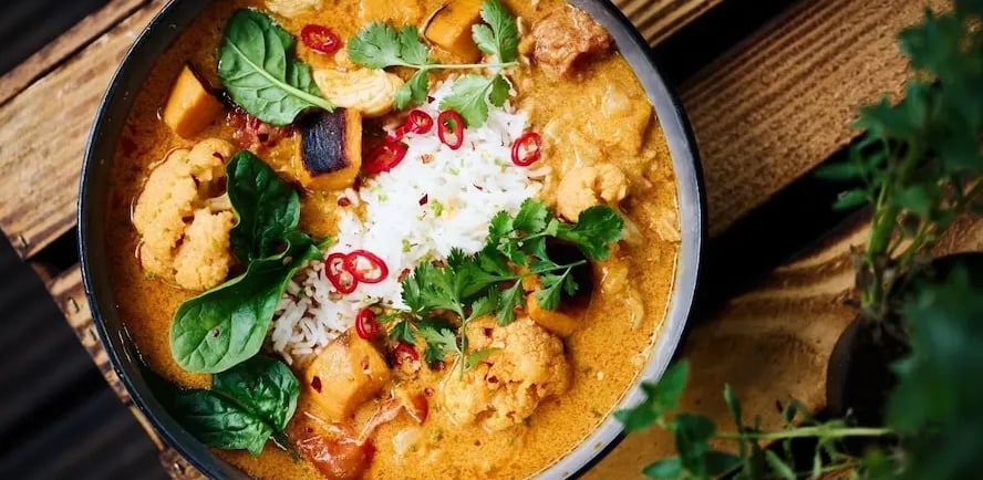 thm-s-recipe-coconut-curry-chicken-on a cutting board