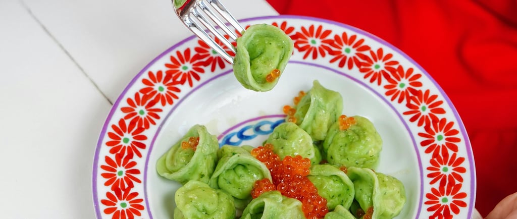 a person holding a fork and fork in their hands