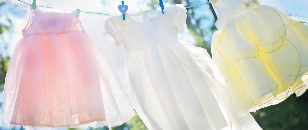 a baby's clothes hanging on a clothes line