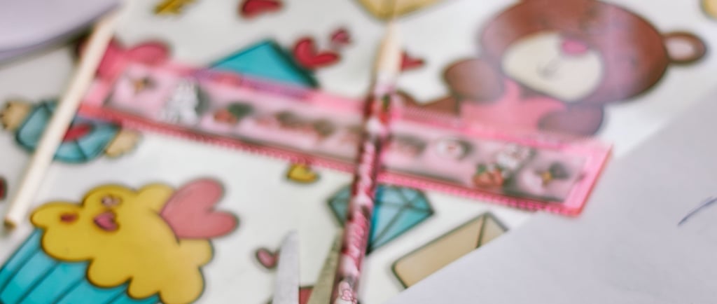 Creative arts and crafts desk with a teddy bear notebook, pink ruler, and cute stickers.