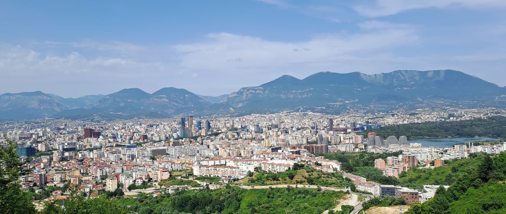 a view of a city from a hill top
