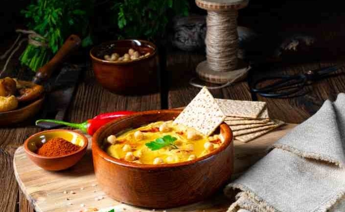 rustic bowl with chickpea curry and small spice bowls