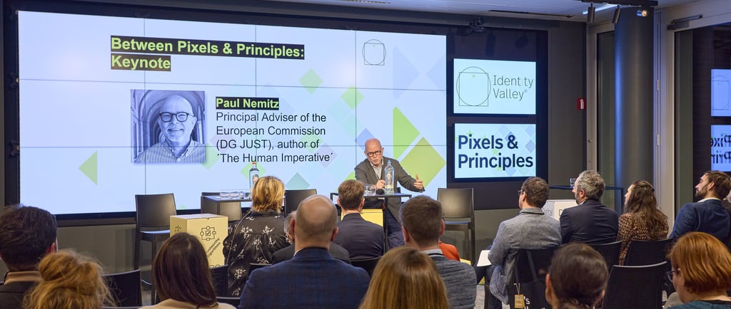 Paul Nemitz standing at a lectern in front of an audience.