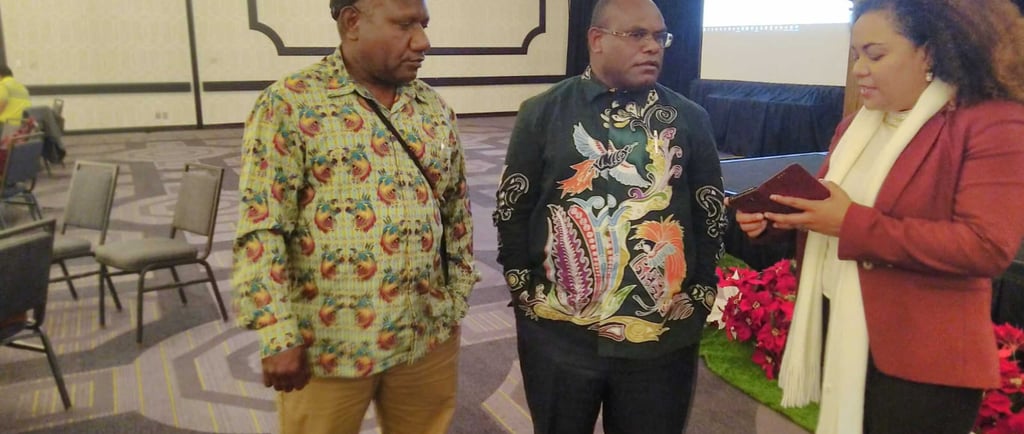 a man and woman standing in a room