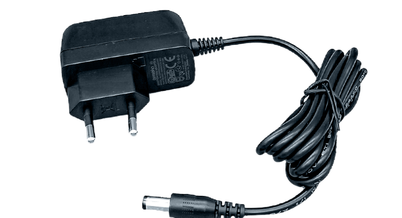 a black and white photo of a power supply plugged in a plugged in
