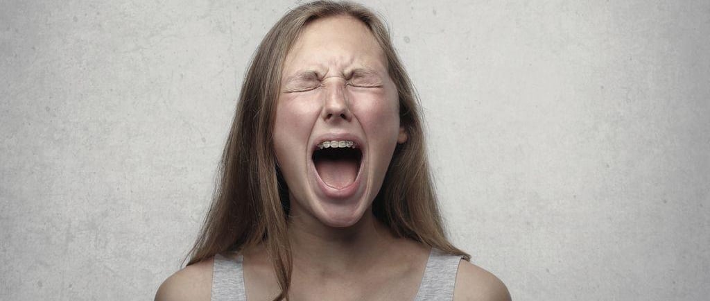 a woman screaming in fear