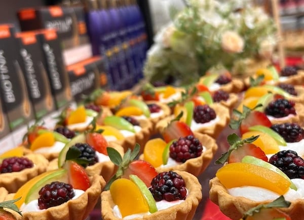 a variety of desserts on display in a store