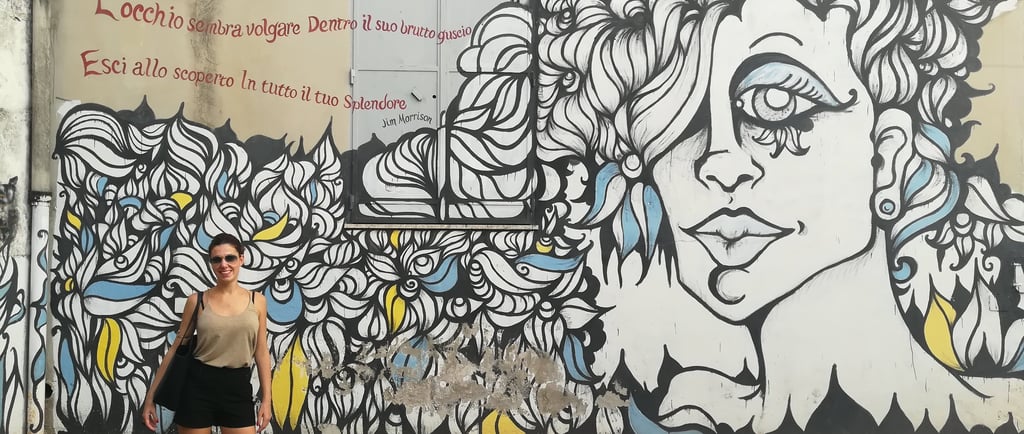 Giusy in front of the Jim Morrison mural in Fornelle, Salerno.