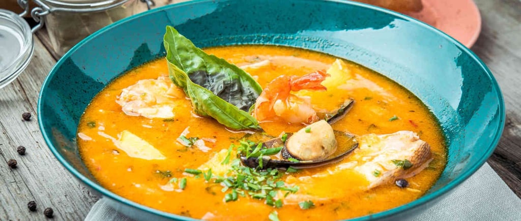 A traditional bouillabaisse served in Marseille, made with fresh Mediterranean fish and saffron brot
