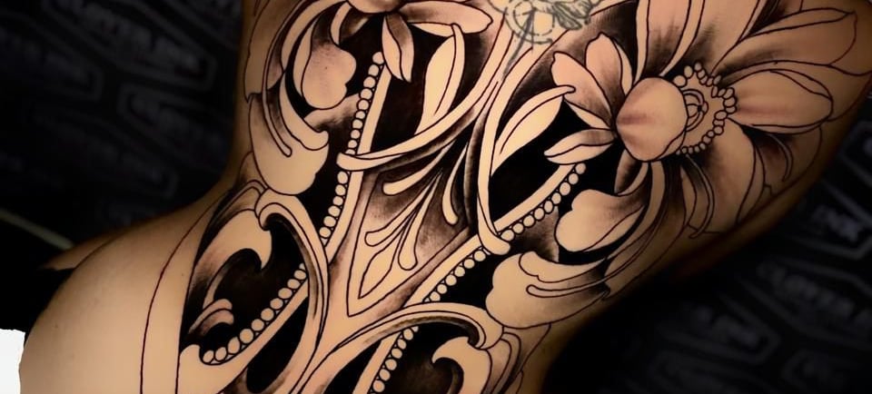 The Clover Ink tattoo artist inking tourist in Bali