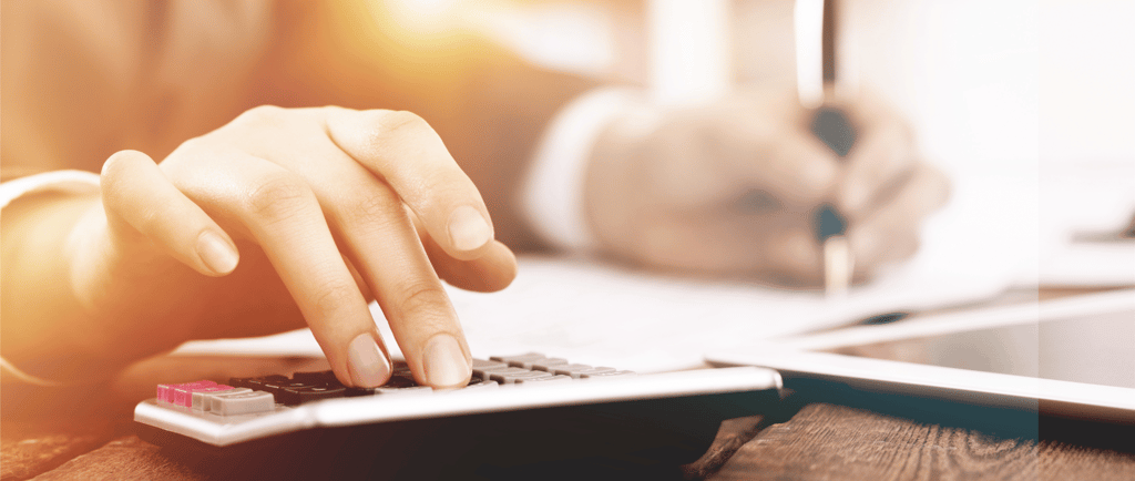 a person using a calculator on a laptop