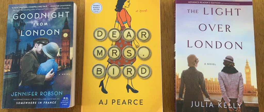 three books on a table with a clock and a clock