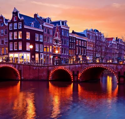 Amsterdam - a bridge over a river with a bridge over it