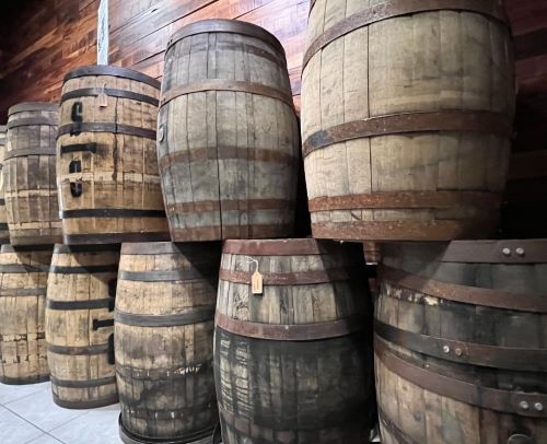 a bunch of barrels of wine barrels stacked on top of each other