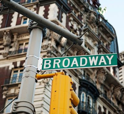 a street sign that says broadway broadway
