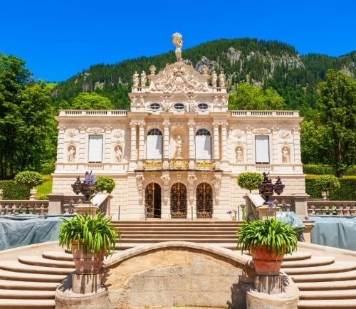 a large castle with a fountain