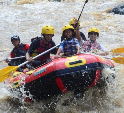 a group of people on a raft raft raft rafting through the water