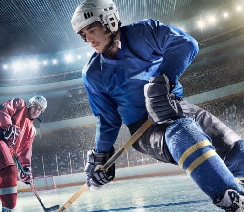 a hockey player is playing hockey in a stadium