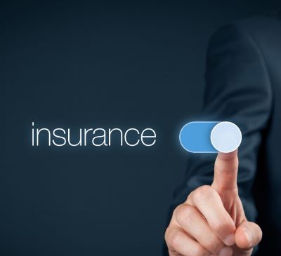 a man in a suit pointing at a button with the word insurance