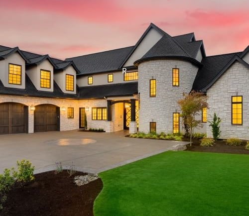 a large house with a large driveway and a driveway
