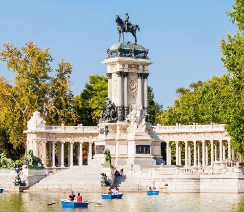 a statue of a man on a boat in the water