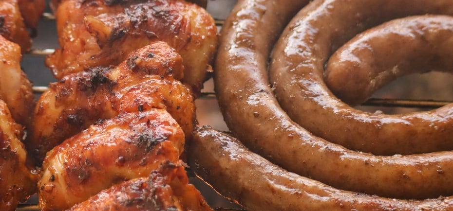a grill with sausages and sausages on it