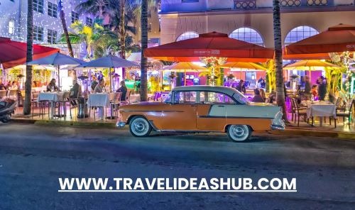 a car parked in front of a building with a red umbrella