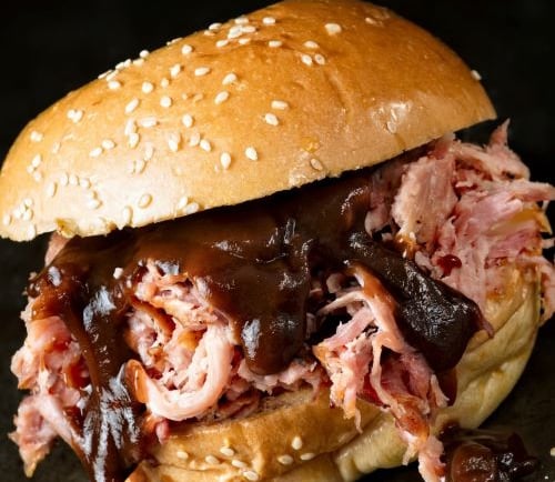 a sandwich sandwich with meat and cheese on a bunt