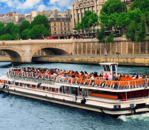 a boat with people on it in the water