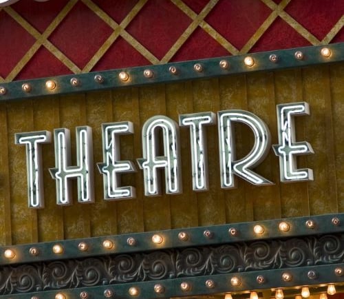 a theatre sign with a large sign that says theatre